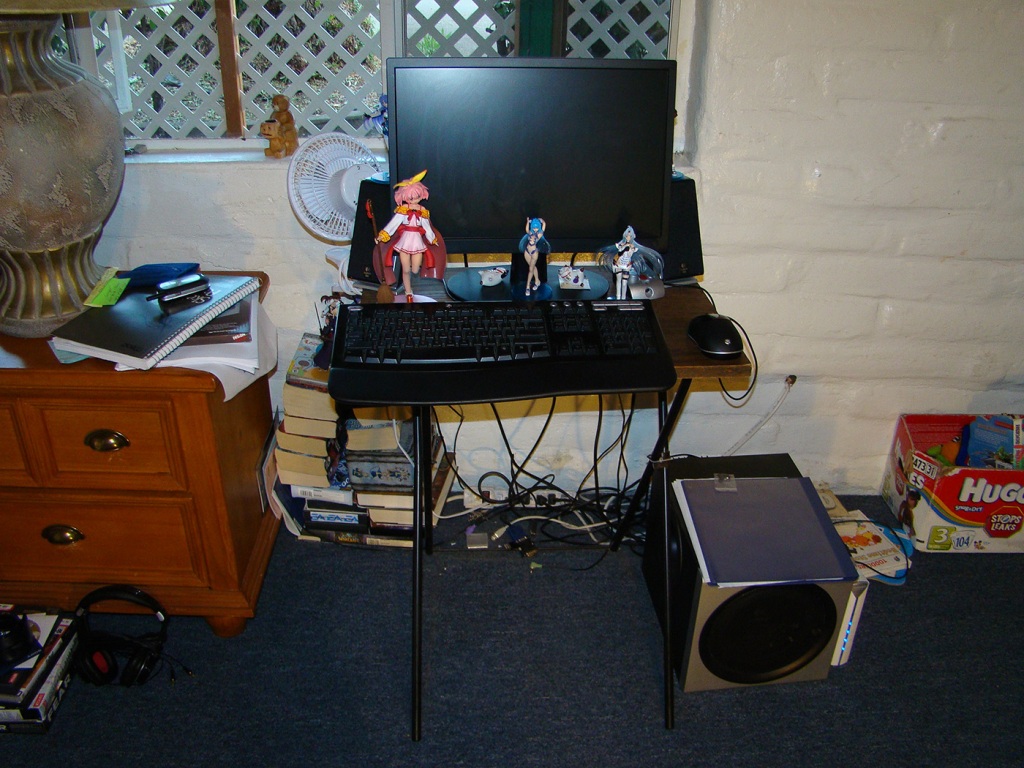 T.V. tray plus wooden entertainment center shelf= ...well a pretty good desk actually. :P